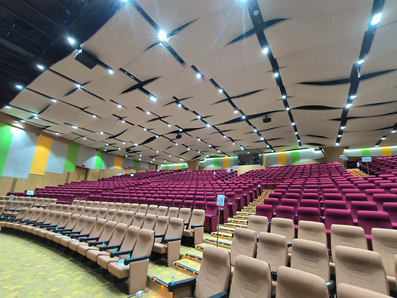 Acoustic baffles suspended in a college auditorium at [Project 2]