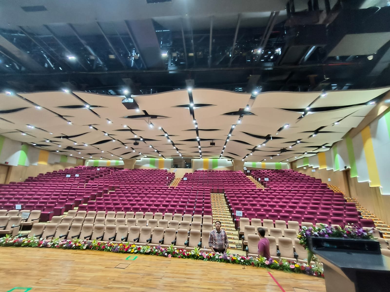 Grooved acoustic panels on auditorium side wall at [Project 2]